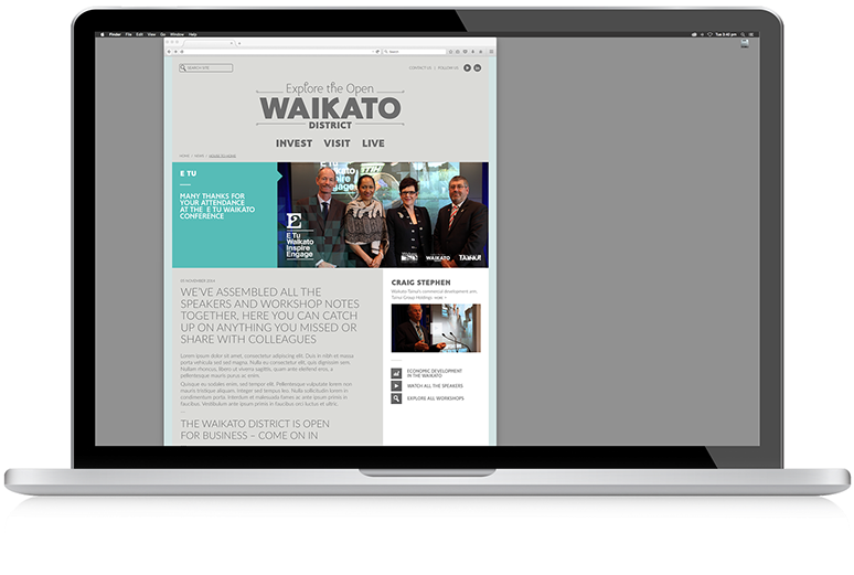 The webpage developed for the conference, displayed on a laptop.